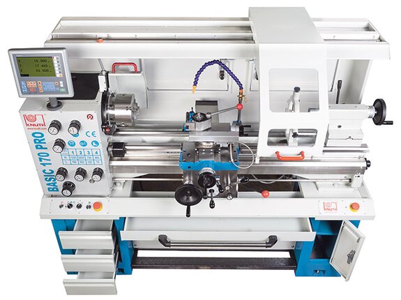 The machine base features ample storage space for accessories and tools, including a chip tray that can be removed at front